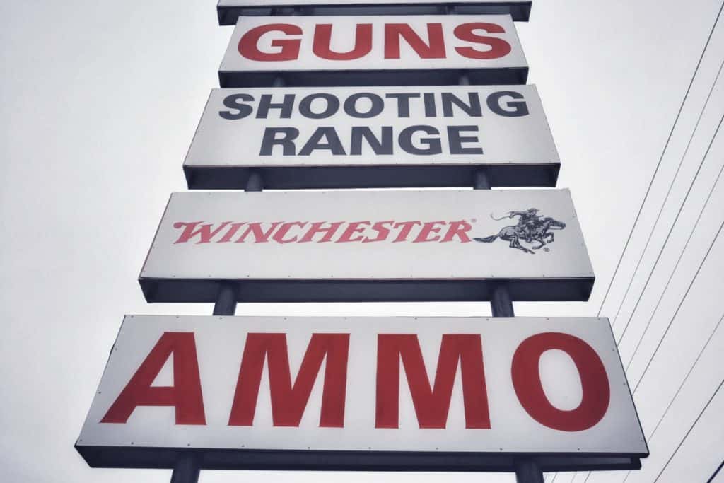 gun shop and shooting range sign